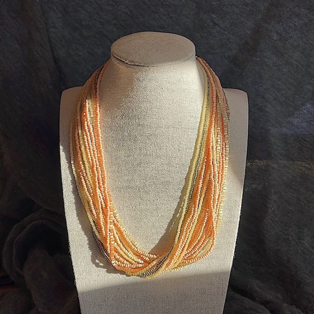 Gorgeous multi strand seed bead necklace in peach, lime, yellow, & silver.